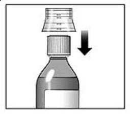 7. Rinse the dosing cup with clean water.
8. Dry the dosing cup using a dry, clean tissue before you put it back onto the cap.  See Figure 5.
